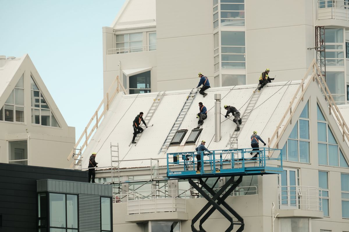 A roofing crew on site, the kind of job photos we build your site around